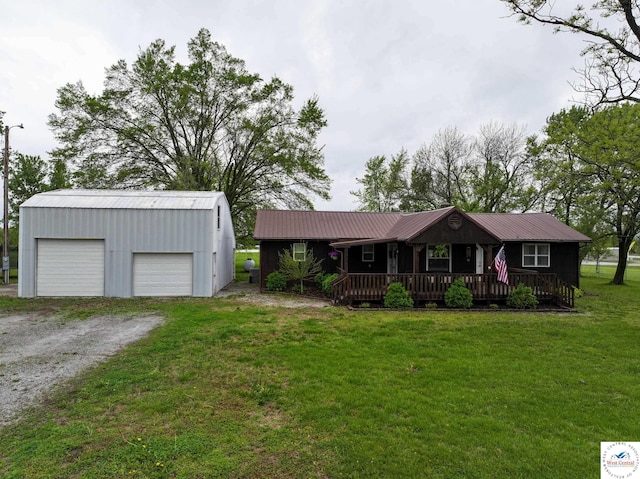 782 SE 250th Rd, Clinton, MO 64735 - ranch-style home featuring a porch, an outbuilding, a front lawn, and a detached garage