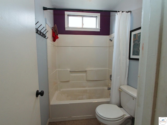 bathroom featuring shower / tub combo with curtain and toilet