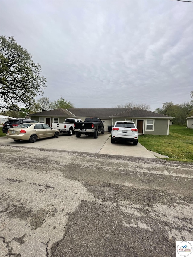 725 N Max Stevens St, Adrian, MO 64720 - view of car parking with concrete driveway