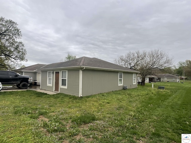 725 N Max Stevens St, Adrian, MO 64720 - view of side of home with a lawn