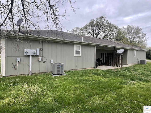 725 N Max Stevens St, Adrian, MO 64720 - back of house featuring central AC and a lawn