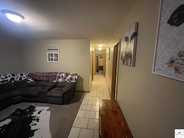 725 N Max Stevens St, Adrian, MO 64720 - living area with light tile patterned flooring and a textured ceiling