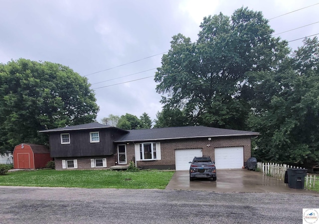 102 S Feaster St, Windsor, MO 65360 - split level home with brick siding, driveway, a storage unit, and an attached garage