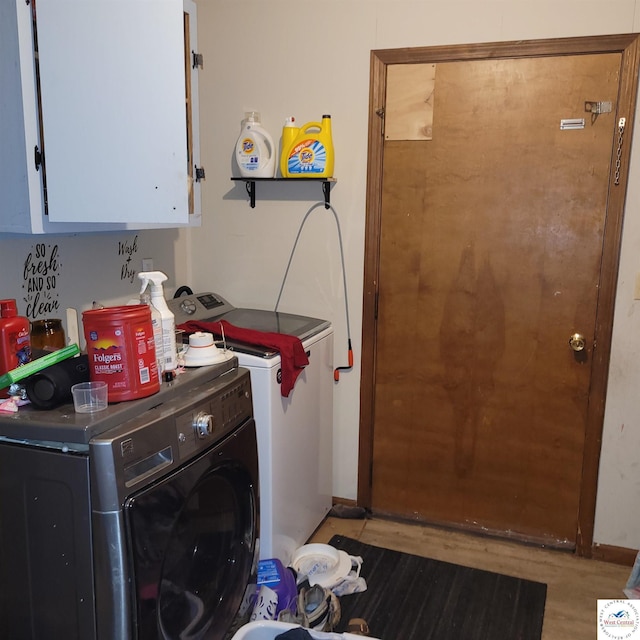 102 S Feaster St, Windsor, MO 65360 - washroom featuring cabinet space, washing machine and dryer, wood finished floors, and baseboards