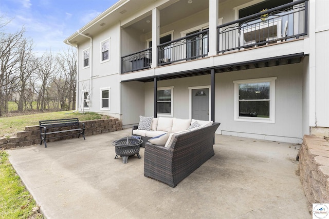 917 N Washboard Rd, Sibley, MO 64088 - view of patio / terrace featuring a balcony and an outdoor living space with a fire pit