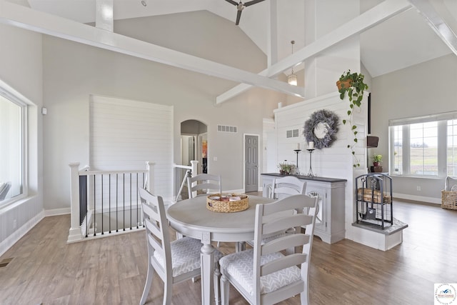 917 N Washboard Rd, Sibley, MO 64088 - dining area with high vaulted ceiling, arched walkways, wood finished floors, and baseboards
