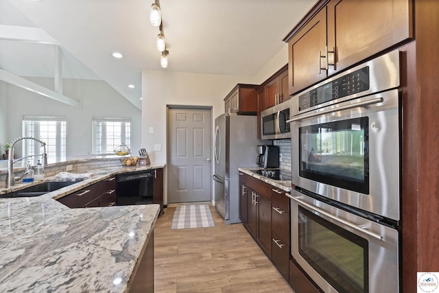 917 N Washboard Rd, Sibley, MO 64088 - kitchen featuring black appliances, a sink, light stone countertops, light wood-style flooring, and recessed lighting