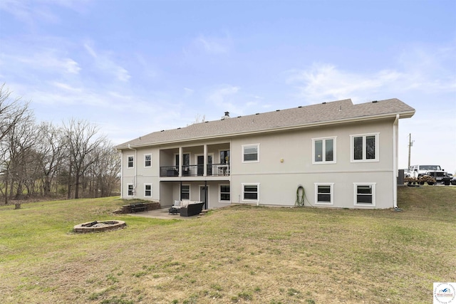 917 N Washboard Rd, Sibley, MO 64088 - rear view of property featuring a fire pit, a patio, a lawn, and stucco siding