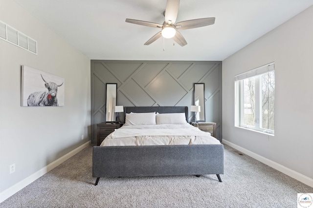 917 N Washboard Rd, Sibley, MO 64088 - bedroom with carpet flooring, baseboards, a decorative wall, and ceiling fan