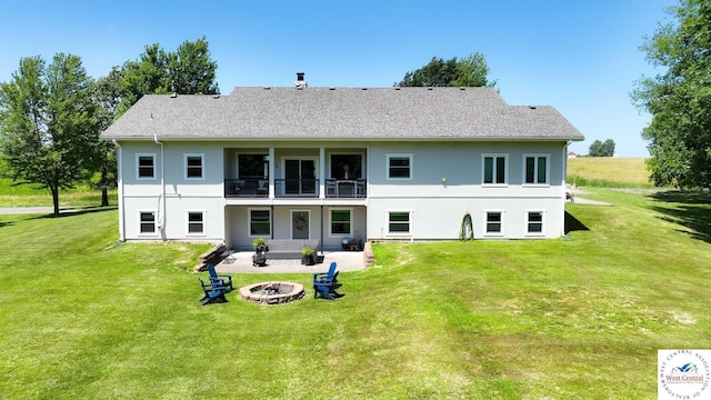 917 N Washboard Rd, Sibley, MO 64088 - rear view of property featuring an outdoor fire pit, a balcony, a patio, and a lawn