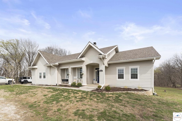 917 N Washboard Rd, Sibley, MO 64088 - ranch-style home with covered porch, a front lawn, a chimney, and a shingled roof