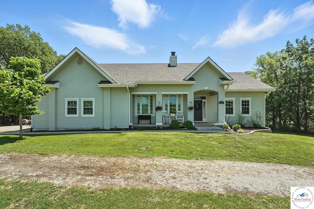 917 N Washboard Rd, Sibley, MO 64088 - view of front facade featuring a chimney, a porch, a front yard, and roof with shingles