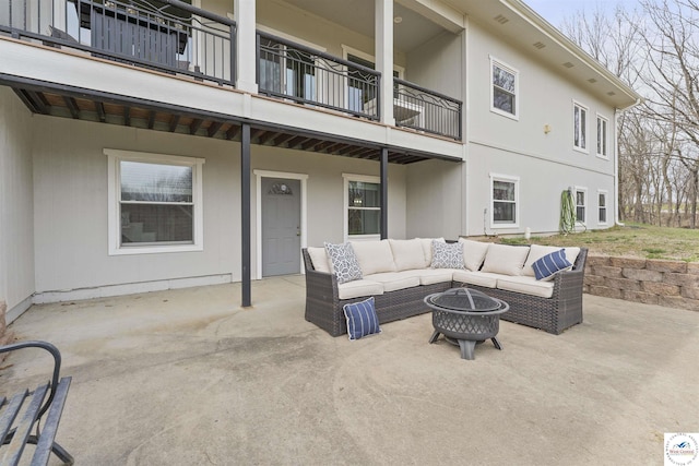 917 N Washboard Rd, Sibley, MO 64088 - view of patio / terrace featuring a balcony and an outdoor living space with a fire pit