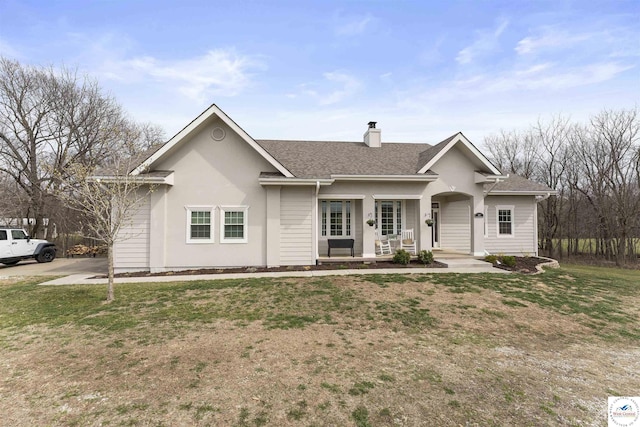 917 N Washboard Rd, Sibley, MO 64088 - single story home featuring a porch, a chimney, a shingled roof, and a front lawn