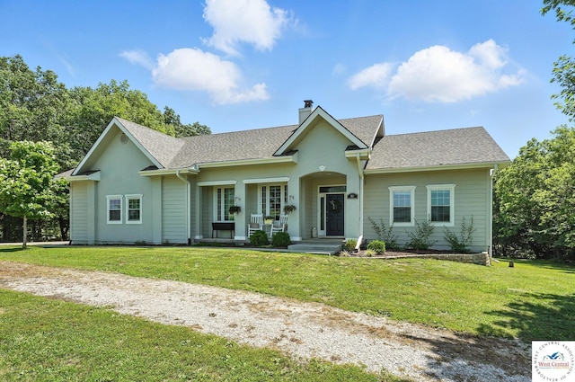 917 N Washboard Rd, Sibley, MO 64088 - ranch-style home with a chimney, a front lawn, covered porch, and a shingled roof