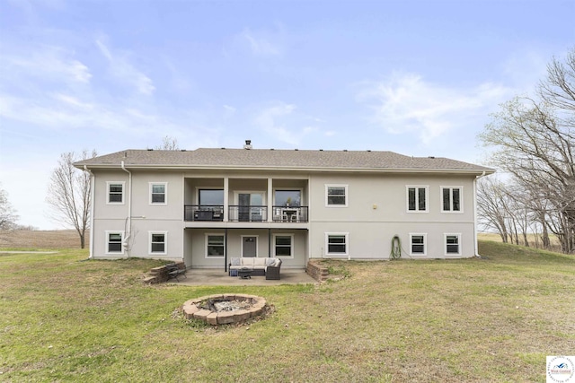 917 N Washboard Rd, Sibley, MO 64088 - back of house with an outdoor living space with a fire pit, a patio, stucco siding, and a yard