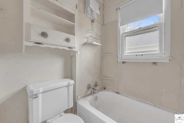 bathroom featuring shower / bathing tub combination and toilet