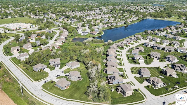 aerial view of residential area with a nearby body of water