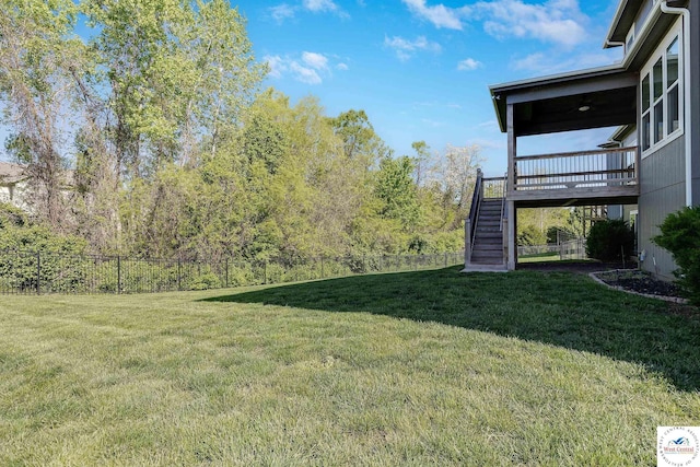 view of yard featuring stairs and a deck