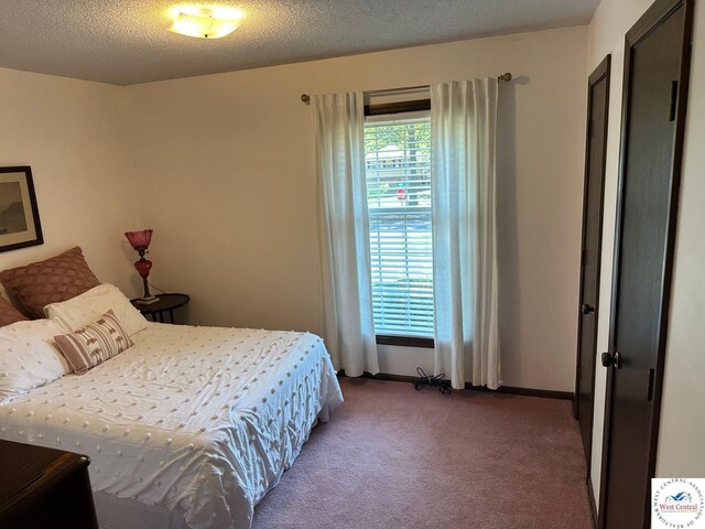 101 N Connie Dr, Clinton, MO 64735 - carpeted bedroom featuring baseboards