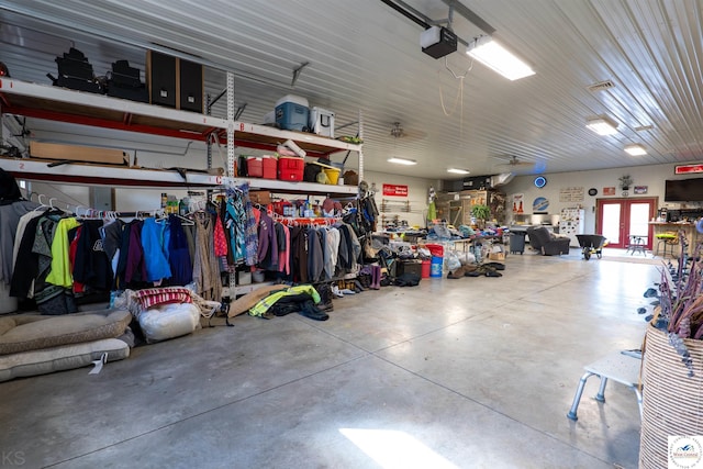garage featuring french doors and a garage door opener