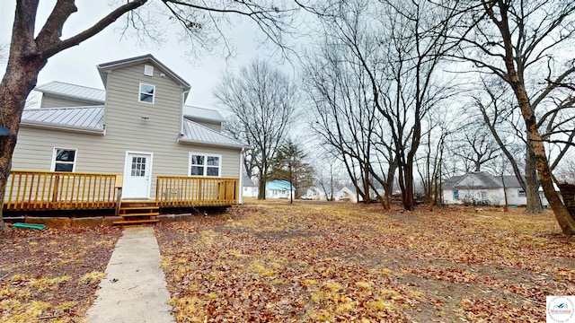 607 E Benton St, Windsor, MO 65360 - back of house with metal roof and a wooden deck