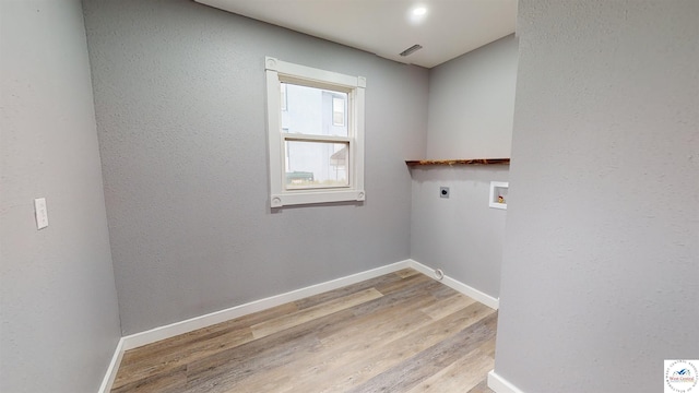 607 E Benton St, Windsor, MO 65360 - laundry room featuring hookup for an electric dryer, laundry area, hookup for a washing machine, baseboards, and wood finished floors