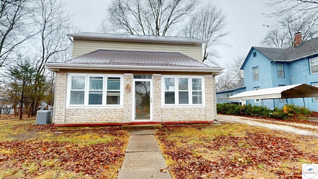 607 E Benton St, Windsor, MO 65360 - bungalow-style home featuring metal roof, a detached carport, stone siding, and central AC unit