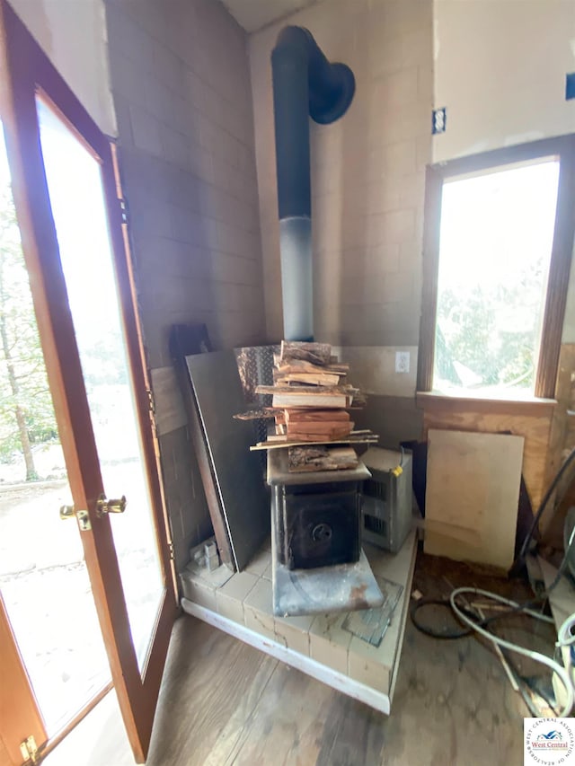 11371 Dawn Dr, Warsaw, MO 65355 - detailed view of a wood stove and wood finished floors