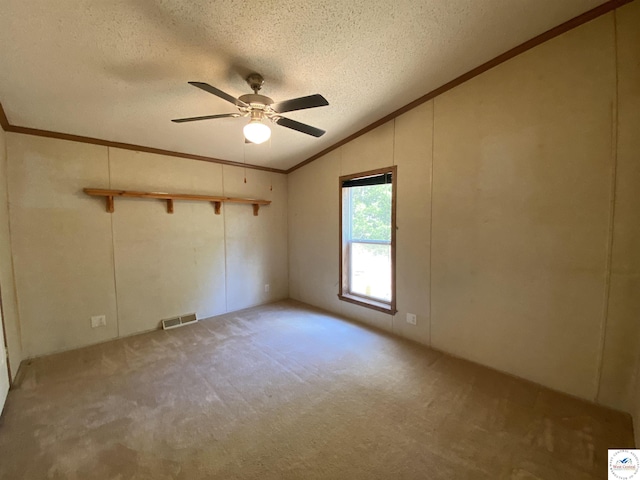 11371 Dawn Dr, Warsaw, MO 65355 - carpeted spare room featuring lofted ceiling, ornamental molding, ceiling fan, and a textured ceiling