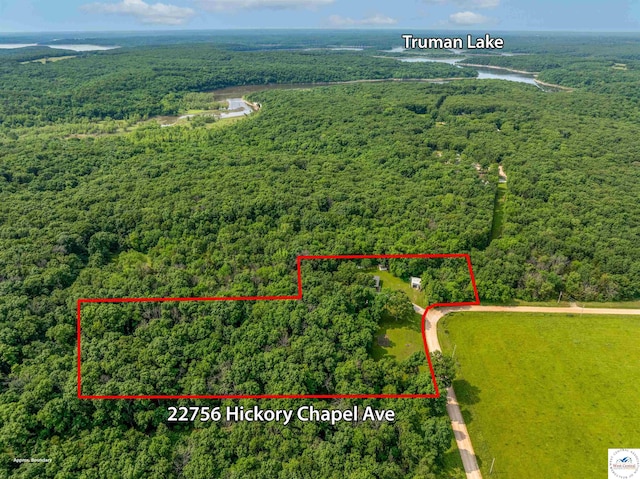 22756 Hickory Chapel Ave, Lincoln, MO 65338 - aerial view of property's location featuring a heavily wooded area, property boundaries highlighted, and a large body of water