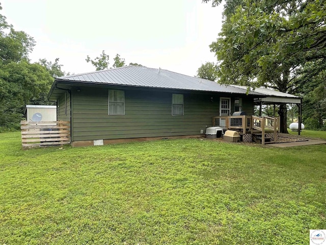 22756 Hickory Chapel Ave, Lincoln, MO 65338 - back of house with a yard and metal roof