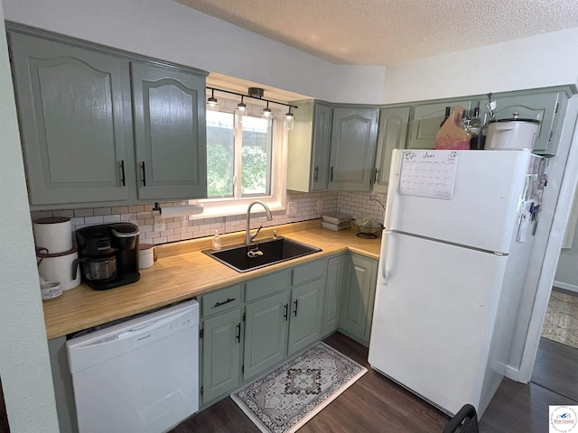 22756 Hickory Chapel Ave, Lincoln, MO 65338 - kitchen with white appliances, a sink, light countertops, dark wood-style floors, and backsplash