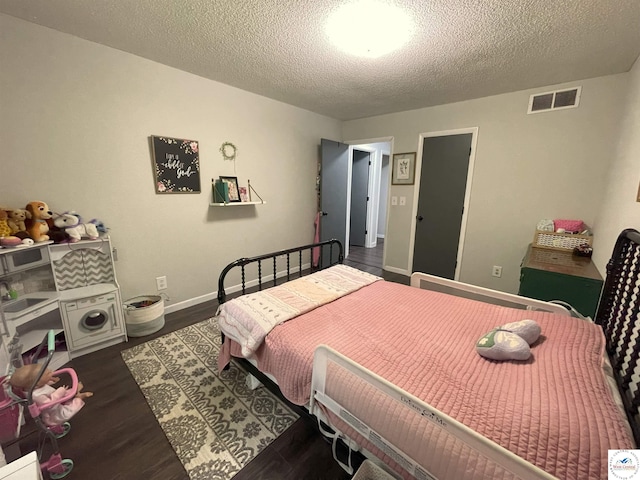 22756 Hickory Chapel Ave, Lincoln, MO 65338 - bedroom with a textured ceiling, dark wood-style floors, and baseboards