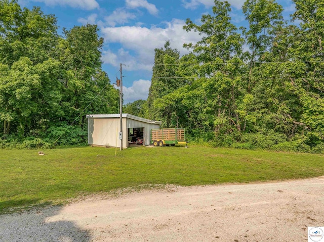 22756 Hickory Chapel Ave, Lincoln, MO 65338 - view of green lawn featuring a pole building and an outdoor structure