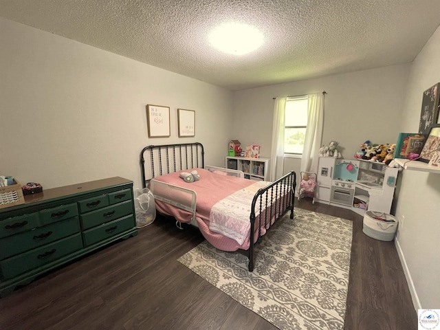 22756 Hickory Chapel Ave, Lincoln, MO 65338 - bedroom with dark wood-style floors and a textured ceiling
