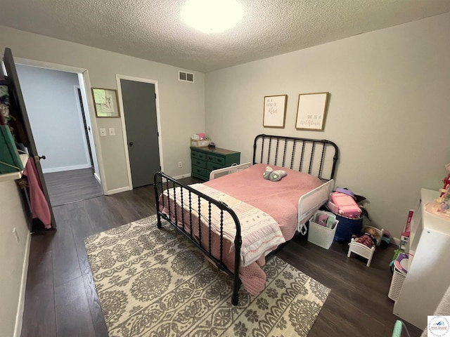 22756 Hickory Chapel Ave, Lincoln, MO 65338 - bedroom with wood finished floors and a textured ceiling