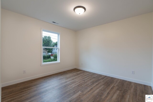 1504 E 7th St, Sedalia, MO 65301 - spare room featuring dark wood finished floors