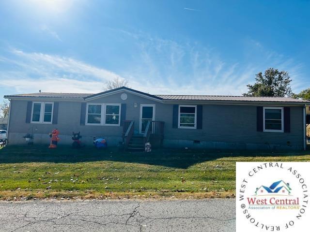 214 SE State St, Milan, MO 63556 - manufactured / mobile home featuring metal roof and a front yard