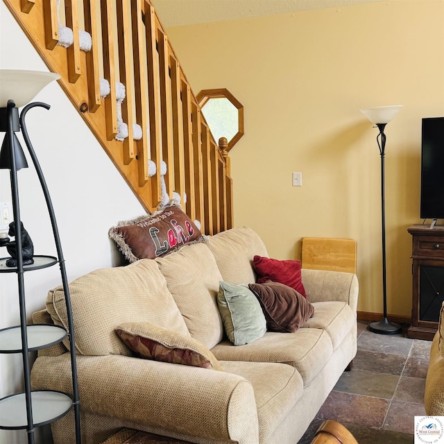 30342 Sassafras Dr, Warsaw, MO 65355 - living room with stone finish floors, stairs, and baseboards