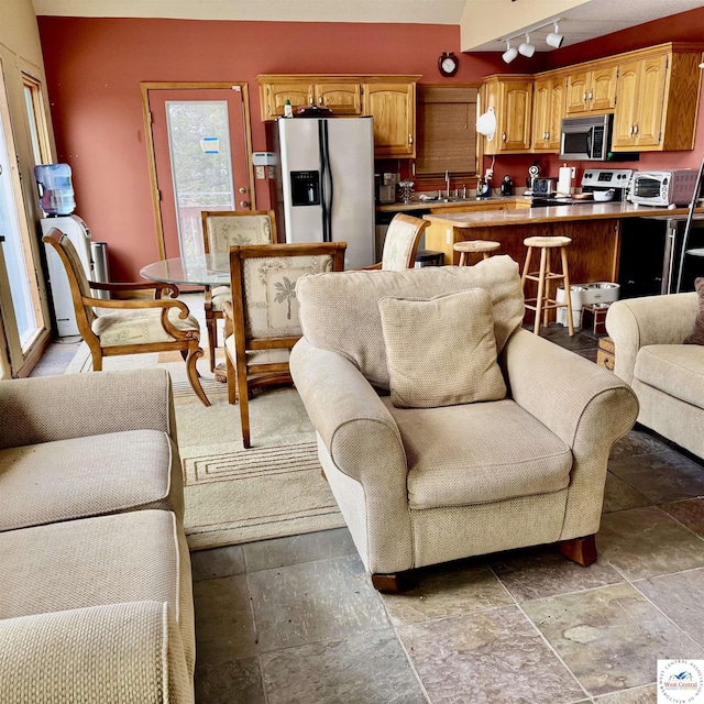 30342 Sassafras Dr, Warsaw, MO 65355 - living room featuring a toaster, track lighting, and stone tile flooring