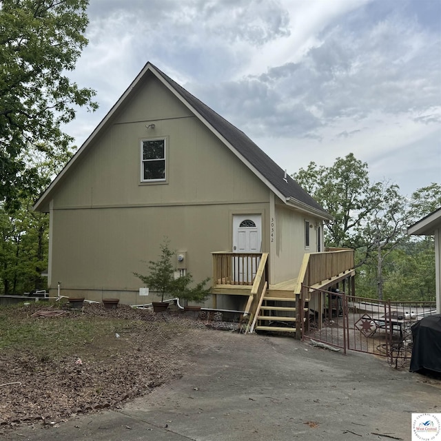 30342 Sassafras Dr, Warsaw, MO 65355 - view of side of home featuring a deck and a patio