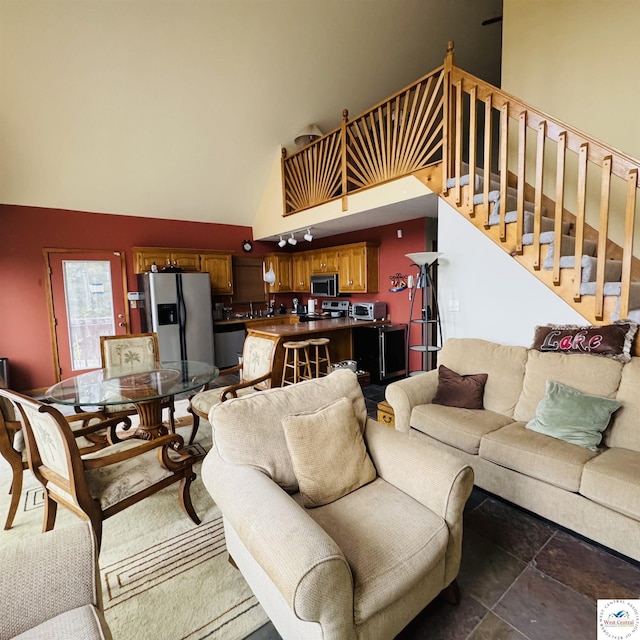 30342 Sassafras Dr, Warsaw, MO 65355 - living room featuring stairway and high vaulted ceiling