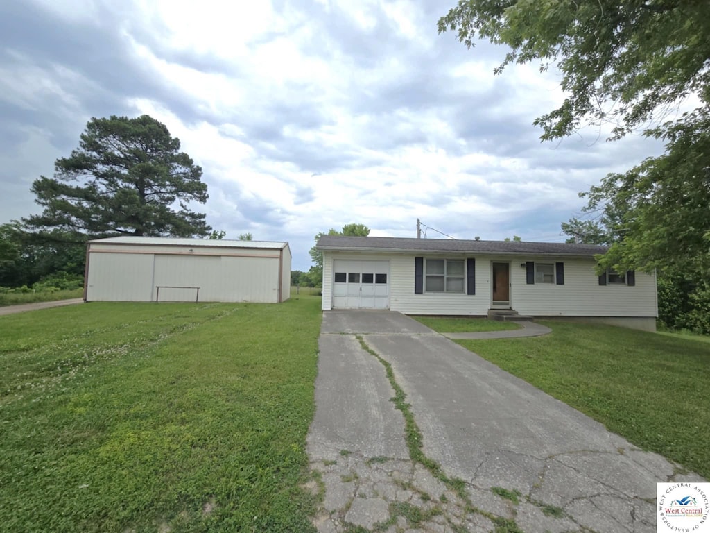28371 Leonard Rd, Centertown, MO 65023 - single story home with driveway, a garage, and a front yard