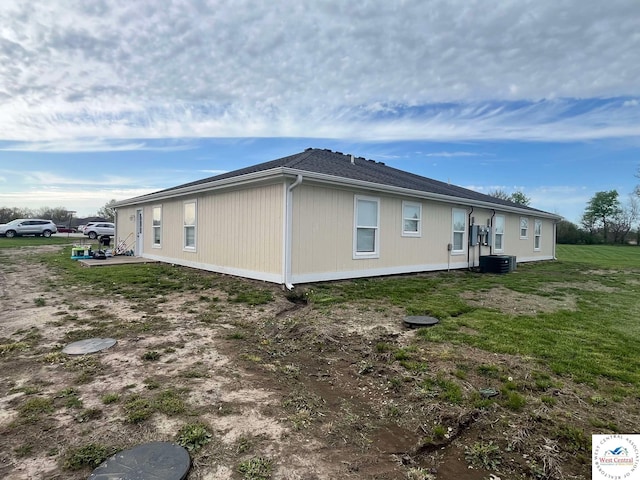 100 NW 4343 P Ln, Clinton, MO 64735 - view of side of home featuring central AC and a yard