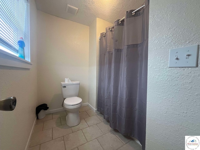 100 NW 4343 P Ln, Clinton, MO 64735 - full bathroom with a shower with curtain, tile patterned floors, toilet, visible vents, and a textured wall