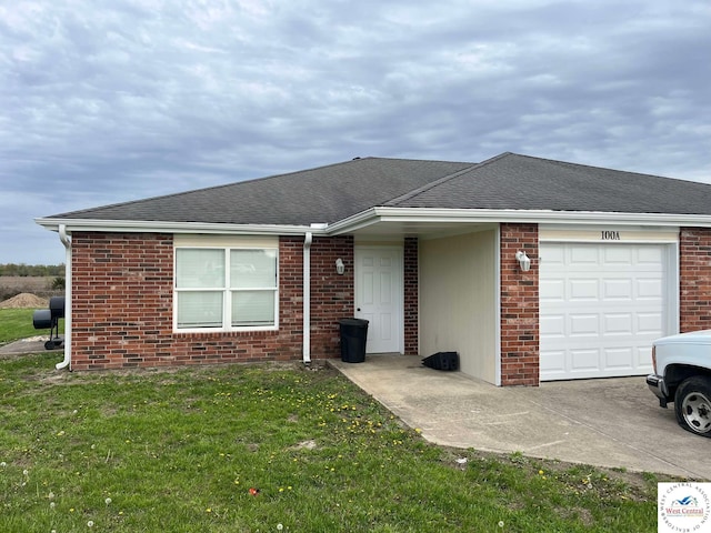 100 NW 4343 P Ln, Clinton, MO 64735 - ranch-style home featuring driveway, a shingled roof, an attached garage, brick siding, and a front lawn