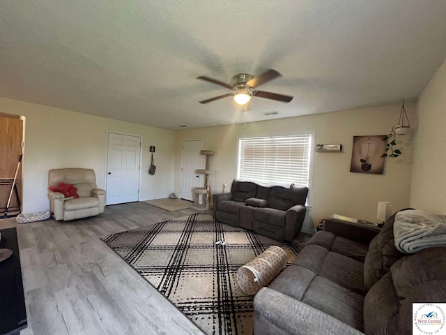 100 NW 4343 P Ln, Clinton, MO 64735 - living area featuring wood finished floors, a ceiling fan, visible vents, and baseboards