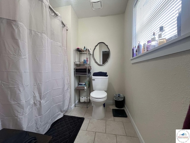 100 NW 4343 P Ln, Clinton, MO 64735 - bathroom with curtained shower, toilet, tile patterned flooring, and baseboards