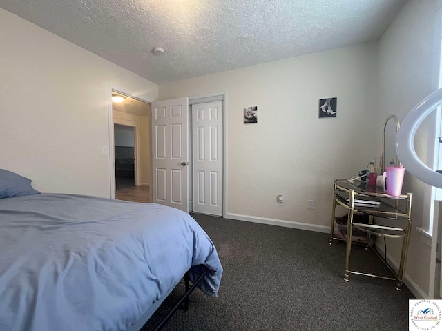 100 NW 4343 P Ln, Clinton, MO 64735 - carpeted bedroom featuring a textured ceiling, a closet, and baseboards